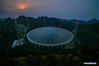Photo taken on March 28, 2021 shows China's Five-hundred-meter Aperture Spherical radio Telescope (FAST) at night in southwest China's Guizhou Province. FAST has identified over 300 pulsars so far. Located in a naturally deep and round karst depression in southwest China's Guizhou Province, it officially began operating on Jan. 11, 2020. (Xinhua/Ou Dongqu)