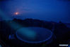 Photo taken on March 28, 2021 shows China's Five-hundred-meter Aperture Spherical radio Telescope (FAST) at night in southwest China's Guizhou Province. FAST has identified over 300 pulsars so far. Located in a naturally deep and round karst depression in southwest China's Guizhou Province, it officially began operating on Jan. 11, 2020. (Xinhua/Ou Dongqu)