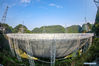 Photo taken with a fisheye lens on March 29, 2021 shows China's Five-hundred-meter Aperture Spherical radio Telescope (FAST) under maintenance in southwest China's Guizhou Province. FAST has identified over 300 pulsars so far. Located in a naturally deep and round karst depression in southwest China's Guizhou Province, it officially began operating on Jan. 11, 2020. (Xinhua/Ou Dongqu)