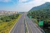 Shenzhen Outer Ring Expressway in Guangdong province. [Photo/Baoan Daily]Shenzhen Outer Ring Express Way opened to traffic on Dec 29, 2020. The highway begins from the Guangzhou-Shenzhen Riverside Expressway in the west and ends at the Yanba Expressway in the east, weaving its way through Shenzhen's districts of Baoan, Guangming, Longhua, Longgang, Pingshan, Dapeng and the city of Dongguan. Spanning 93 kilometers, it is a two-direction six-lane road, with a design speed of 80 to 100 km per hour.