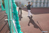 Tseng Chun-an (R) talks with a teacher in Xinji Center Primary School in Yizheng, east China's Jiangsu Province, April 9, 2021. Born in a 