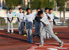 Students take part in a baseball training session in Xinji Center Primary School in Yizheng, east China's Jiangsu Province, April 9, 2021. Born in a 