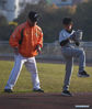 Tseng Chun-an (L) teaches his student during a baseball training session in Xinji Center Primary School in Yizheng, east China's Jiangsu Province, April 9, 2021. Born in a 