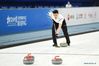 An athlete competes during a curling test program at National Aquatics Center in Beijing, April 1, 2021. A 10-day ice sports test program for the 2022 Olympic and Paralympic Winter Games is held between April 1 and 10, 2021. This test program is to give a test to competition organization, venue operation, and services and safeguarding. It will engage all ice sports of Beijing 2022, namely short track speed skating, speed skating, figure skating, ice hockey, curling, para ice hockey and wheelchair curling. (Xinhua/Ju Huanzong)