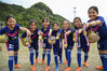 2021年4月26日，浙江省金华市浦江县西部大山里的金融希望小学操场上，一群山里女娃在展示自己的足球冠军奖牌。来源：视觉中国
