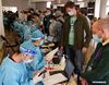 Foreign recipients get registered for Sinovac COVID-19 vaccines at a vaccination site in Tsinghua University, Beijing, April 3, 2021. [Xinhua/Chen Zhonghao]