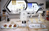 Photo taken on May 9, 2021 shows a domestically produced coffee robot on display in the Provinces, Municipalities, Autonomous Regions of China Exhibition Hall during the first China International Consumer Products Expo in Haikou, capital of south China's Hainan Province. (Xinhua/Guo Cheng)