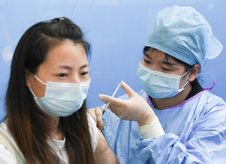 People receive COVID-19 vaccines in Hefei, China's Anhui