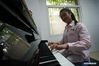 Zhou Wenqing plays her original melody at Nanjing Normal University of Special Education in Nanjing, east China's Jiangsu Province, May 17, 2019. Zhou Wenqing, a blind student from Nanjing Normal University of Special Education, recently received a tentative offer from Renmin University of China to pursue a master's degree in Applied Psychology. Born in 1998, Zhou Wenqing left hometown at the age of eight to pursue study opportunities alone. In 2017, she was admitted to Nanjing Normal University of Special Education to study Applied Psychology. Confronting the challenges that ordinary students could not imagine, Zhou still made her four-year college life rich and colorful. She passed through CET-6 exam, won the National Scholarship, the National Inspirational Scholarship and so on. Academically, she has kept being on the top of the list. After class, Zhou Wenqing studied broadcasting and has hosted for several times. Knowledge lights up the night sky. Zhou Wenqing uses her knowledge and warm heart to enlighten more hearts. She presided over a provincial key entrepreneurial project, developing a learning APP and a series of courses for disabled people. She also volunteered to be a teaching assistant at 