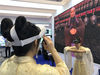 A virtual reality-powered equipment which helps spread Confucianism is displayed on Friday during the 56th Higher Education Expo China in Qingdao, Shandong province. [Photo by Hu Qing/chinadaily.com.cn]