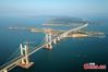 The undated photo shows the Pingtan Strait Road-rail Bridge in southeast China’s Fujian. (China News Service/Wang Dongming)
As the world's longest cross-sea road-rail bridge, the 16.34 km project connects Pingtan Island in Fujian with four nearby islets.
The upper level of the bridge, opening for trial operation on Oct 1, 2020, is a two-way six-lane freeway with a designed speed of 100 km/h, while the lower level, opening on December 26, 2020, is a two-line railway with a designed speed of 200 km/h.
