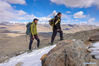Bikmirza Turdil (R) takes part in a targeted training on the Muztagh Ata in northwest China's Xinjiang Uygur Autonomous Region, May 15, 2021. Bikmirza, a 24-year-old Kirghiz herdsman, was born and raised at the foot of the Muztagh Ata, a peak with an elevation of more than 7,500 meters, in the Pamirs of China's Xinjiang Uygur Autonomous Region. He started to work as a guide helping climbers carry equipment and supplies at the age of 18. Climbing Muztagh Ata, a symbol of bravery, is even regarded as the coming-of-age ceremony for local youngsters. 