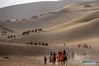 Tourists visit Yueya Spring, a crescent-shaped lake in Dunhuang City, northwest China's Gansu Province, May 1, 2021. Official data showed 230 million domestic tourist trips were made during the five-day Labor Day holiday, up 119.7 percent from last year. (Photo by Zhang Xiaoliang/Xinhua)