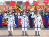 Astronauts Nie Haisheng (R), Liu Boming (C) and Tang Hongbo wave during a see-off ceremony for Chinese astronauts of the Shenzhou-12 manned space mission at the Jiuquan Satellite Launch Center in northwest China, June 17, 2021. (Xinhua/Li Gang)