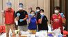 Volunteers in charge of delivering necessities for residents under home quarantine pose for a group photo at a residential area at Liwan District of Guangzhou, capital of south China's Guangdong Province, June 1, 2021. Guangzhou has tightened anti-epidemic measures in parts of the city to curb the recent COVID-19 resurgence, local authorities said Tuesday. The city has implemented closed-off management on the Zhongnan subdistrict as well as 37 other locations and their surroundings. People in these areas must follow strict quarantine measures and stay indoors. Residents join the volunteer team, delivering food, necessities and epidemic prevention materials for people under home quarantine. (Xinhua/Deng Hua)