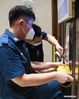 Staff members of a property management company paste removable protective covering on the buttons of an elevator at a residential area at Liwan District of Guangzhou, capital of south China's Guangdong Province, June 2, 2021. Guangzhou has tightened anti-epidemic measures in parts of the city to curb the recent COVID-19 resurgence, local authorities said Tuesday. The city has implemented closed-off management on the Zhongnan subdistrict as well as 37 other locations and their surroundings. People in these areas must follow strict quarantine measures and stay indoors. Residents join the volunteer team, delivering food, necessities and epidemic prevention materials for people under home quarantine. (Xinhua/Deng Hua)