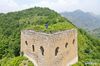 Aerial photo taken on July 7, 2021 shows Zhang Heshan weeding on the Chengziyu Great Wall in Qinhuangdao, north China's Hebei Province. Zhang Heshan, 66, is a villager of Chengziyu, where lies a section of China's Great Wall dating back to Ming Dynasty (1368-1644). Since 1978, Zhang has been a protector of the Great Wall. 