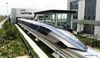 Aerial photo taken on July 20, 2021 shows China's new maglev transportation system in Qingdao, east China's Shandong Province. China's new high-speed maglev train rolled off the production line on Tuesday. It has a designed top speed of 600 km per hour -- currently the fastest ground vehicle available globally. The new maglev transportation system made its public debut in the coastal city of Qingdao, east China's Shandong Province. It has been self-developed by China, marking the country's latest scientific and technological achievement in the field of rail transit, according to the China Railway Rolling Stock Corporation. (Xinhua/Li Ziheng)