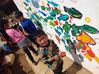 Children from Guanzhong village join in the mural creation. [Photo provided to chinadaily.com.cn]