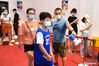 Residents take part in a COVID-19 nucleic acid test at a community in Jiangning District of Nanjing, capital of east China's Jiangsu Province, July 24, 2021. A second round of COVID-19 nucleic acid test was launched Saturday in Jiangning District of Nanjing. The eastern Chinese city on Friday reported 12 new locally transmitted COVID-19 cases and four asymptomatic ones, local health authorities said on Saturday. (Xinhua/Ji Chunpeng)