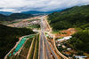 Aerial photo taken on July 2, 2021 shows a section of the China-Laos railway under construction in Ning'er Hani and Yi Autonomous County of Puer City, southwest China's Yunnan Province. The China-Laos railway, which stretches more than 1,000 km from Kunming, capital of China's Yunnan Province, to Vientiane of Laos is scheduled to open in December this year. Upon completion, it will slash the travel time between the two cities to less than one day, according to China State Railway Group Co., Ltd. (Xinhua/Wang Guansen)