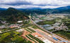 Aerial photo taken on July 2, 2021 shows a section of the China-Laos railway under construction in Ning'er Hani and Yi Autonomous County of Puer City, southwest China's Yunnan Province. The China-Laos railway, which stretches more than 1,000 km from Kunming, capital of China's Yunnan Province, to Vientiane of Laos is scheduled to open in December this year. Upon completion, it will slash the travel time between the two cities to less than one day, according to China State Railway Group Co., Ltd. (Xinhua/Wang Guansen)