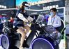 A visitor tries virtual reality spinning based on 5G technology at the digital achievement exhibition during the fourth Digital China Summit in Fuzhou, Fujian province, on April 25, 2021. [Photo/Xinhua]