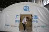 Staff members build a “Falcon” air-inflated testing lab for COVID-19 nucleic acid testing at the Yangzhou International Exhibition Center in Yangzhou, East China's Jiangsu province, on Aug 10, 2021. [Photo by Meng Delong/for China Daily]