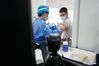 A student receives a dose of COVID-19 vaccine at a vaccination point of Wenshu middle school in Nanjing, east China's Jiangsu Province, Aug. 23, 2021. Nanjing started administering the first dose of COVID-19 vaccines among minors aged between 12 and 17. (Xinhua/Ji Chunpeng)