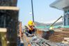 A worker works at the construction site for the expansion project of Kashgar International Airport in Kashgar, northwest China's Xinjiang Uygur Autonomous Region, Aug. 7, 2021. The expansion project of Kashgar International Airport is expected to be completed by the end of the year. (Xinhua/Gao Han)
