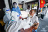 A citizen receives test at a nucleic acid testing point in Yangzhou, east China's Jiangsu Province, Aug. 7, 2021. Yangzhou now has one high-risk area and 75 medium-risk areas for COVID-19, and the city authorities have strengthened the prevention and control measures to halt the spread of the coronavirus. (Xinhua/Li Bo)