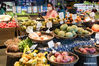 Citizens buy foods at a supermarket in Yangzhou City, east China's Jiangsu Province, Aug. 4, 2021. Yangzhou now has one high-risk area and 75 medium-risk areas for COVID-19, and the city authorities have strengthened the prevention and control measures to halt the spread of the coronavirus. (Xinhua/Li Bo)