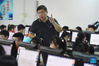 Yang Sen gives a computer class at Heping Primary School in Hefei City, east China's Anhui Province, Sept. 8, 2021. Yang Sen, a computer teacher from Heping Primary School, has interest in graphical language applied to robots in his spare time. After class, he organizes a robot club instructing his students to explore the use of multiple sensors and various scientific principles. (Xinhua/Zhou Mu)