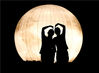 2021年9月15日，江苏苏州，两名村民在中秋灯会的巨型气模“圆月”前打卡留影。