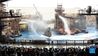 Tourists watch a stunt performance at the theme land of WaterWorld at the Universal Beijing Resort in Beijing, capital of China, Sept. 20, 2021. The Universal Beijing Resort, currently the largest in scale worldwide, opened to the public on Monday. The resort, covering 4 square km, includes the highly anticipated Universal Studios Beijing theme park, the Universal CityWalk, and two hotels. (Xinhua/Ren Chao)