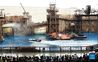 Tourists watch a stunt performance at the theme land of WaterWorld at the Universal Beijing Resort in Beijing, capital of China, Sept. 20, 2021. The Universal Beijing Resort, currently the largest in scale worldwide, opened to the public on Monday. The resort, covering 4 square km, includes the highly anticipated Universal Studios Beijing theme park, the Universal CityWalk, and two hotels. (Xinhua/Ren Chao)
