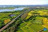 Aerial photo taken on Sept. 22, 2021 shows a high-speed train running by rice fields in Baijiu Village of Quanjiao County, east China's Anhui Province. Thursday marks the Chinese farmers' harvest festival, which is celebrated on the Autumn Equinox every year. (Photo by Shen Guo/Xinhua)