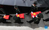 Coffins containing the remains of Chinese People's Volunteers (CPV) martyrs are escorted by soldiers during a burial ceremony at the CPV martyrs' cemetery in Shenyang, northeast China's Liaoning Province, Sept. 3, 2021. The remains of 109 Chinese soldiers killed in the 1950-53 Korean War were laid to rest on Friday in Shenyang. (Xinhua/Yang Qing)