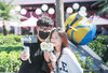 Tourists take selfies at the Universal Beijing Resort on Sept 21, 2021. [Photo/IC]