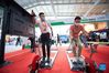 A visitor (R) tries a ski simulator during the 2021 China International Fair for Trade in Services (CIFTIS) in Beijing, capital of China, Sept. 3, 2021. (Xinhua/Chen Zhonghao)