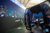 People sit in a 3D cable car during the 2021 China International Fair for Trade in Services (CIFTIS) in Beijing, capital of China, Sept. 3, 2021. (Xinhua/Chen Zhonghao)