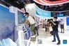 A man tries a ski simulator during the 2021 China International Fair for Trade in Services (CIFTIS) in Beijing, capital of China, Sept. 3, 2021. (Xinhua/Chen Yehua)