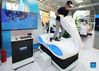 A visitor tries a VR-powered ski simulator during the 2021 China International Fair for Trade in Services (CIFTIS) in Beijing, capital of China, Sept. 3, 2021. (Xinhua/Zhang Chenlin)