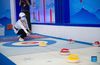 A participant tries floor curling during the 2021 China International Fair for Trade in Services (CIFTIS) in Beijing, capital of China, Sept. 3, 2021. (Xinhua/Chen Zhonghao)