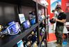 A visitor chooses ski helmets during the 2021 China International Fair for Trade in Services (CIFTIS) in Beijing, capital of China, Sept. 3, 2021. (Xinhua/Chen Zhonghao)