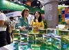 Irish ambassador to China Ann Derwin (L) introduces Irish cheese products to a journalist at the booth of Ireland during the 2021 China International Fair for Trade in Services (CIFTIS) in Beijing, capital of China, Sept. 3, 2021. (Xinhua/Wu Wei)