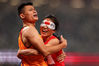 Chinese sprinter Liu Cuiqing and her guide, Xu Donglin, celebrate victory in the women's 200m T11 final at the Tokyo 2020 Paralympic Games on Sept 4.