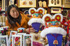 Staff members were displaying tiger hats created by folk cloth master Gao Yong.