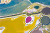 2022年8月13日，航拍山西运城多彩盐湖。盐湖色彩斑斓，如上帝的调色盘。近日，山西运城，盐湖藻类大量繁殖，湖水呈现出丰富色彩。其高饱和度的色彩，蔚为壮观。在持续高温天气影响下，运城盐湖部分卤水池水量减少，剩余的池水在干涸池底的映衬下，呈现出五颜六色且形态各异的天然图案，在航拍镜头下显得既神奇又壮观。
