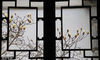 2024年3月11日，苏州市耦园内含苞欲放的玉兰花与古典花窗相映成趣。
